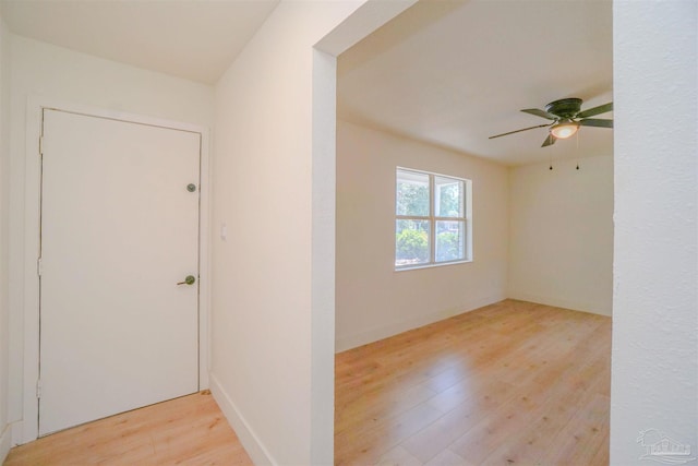 foyer featuring ceiling fan and light hardwood / wood-style floors