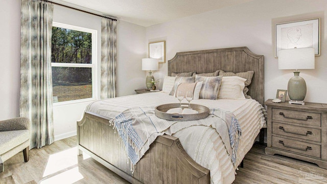 bedroom with light hardwood / wood-style floors