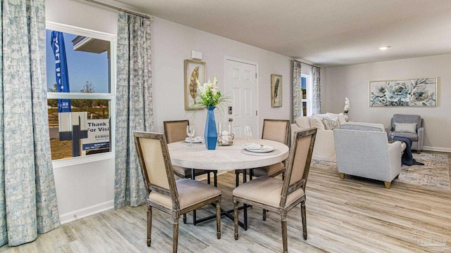 dining room with light hardwood / wood-style flooring