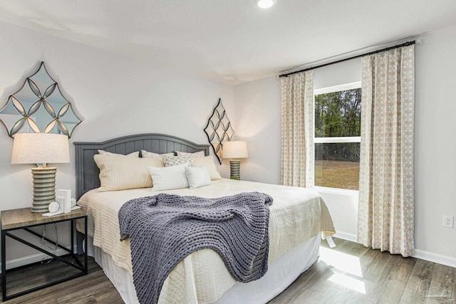 bedroom with hardwood / wood-style floors