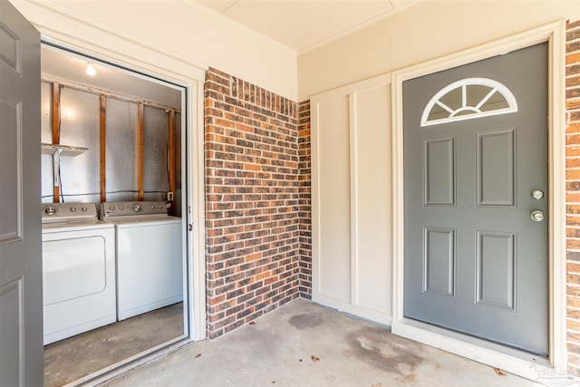 doorway to property featuring independent washer and dryer