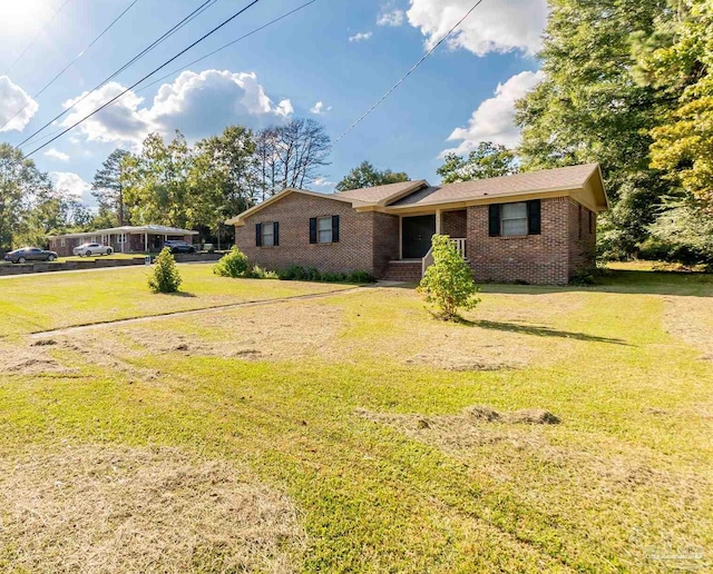 ranch-style house featuring a front yard