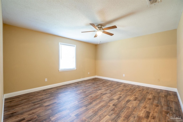 unfurnished room with a textured ceiling, ceiling fan, and dark hardwood / wood-style flooring