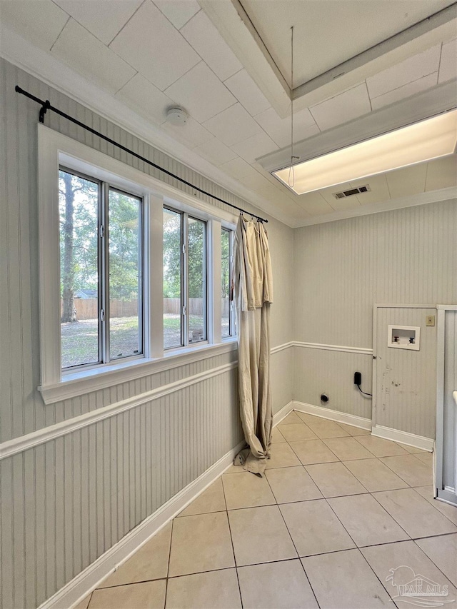 704 E Horner St, Atmore, AL 36502 - laundry room featuring washer hookup, light tile patterned floors, and baseboards