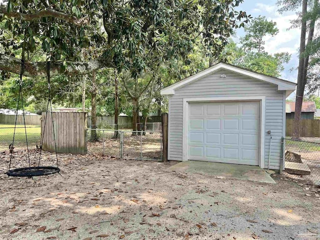 704 E Horner St, Atmore, AL 36502 - detached garage featuring driveway