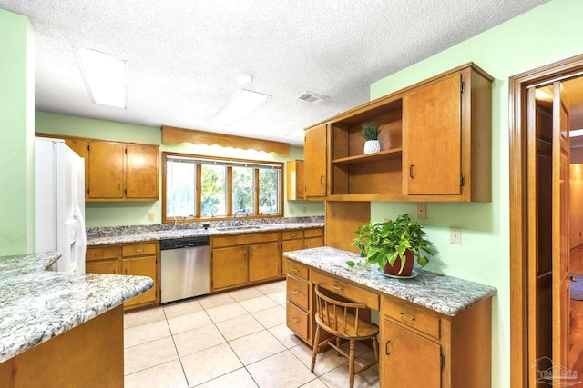 kitchen featuring white refrigerator with ice dispenser, dishwasher, light tile patterned floors, a textured ceiling, and sink