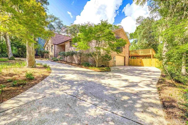 view of side of home featuring a garage