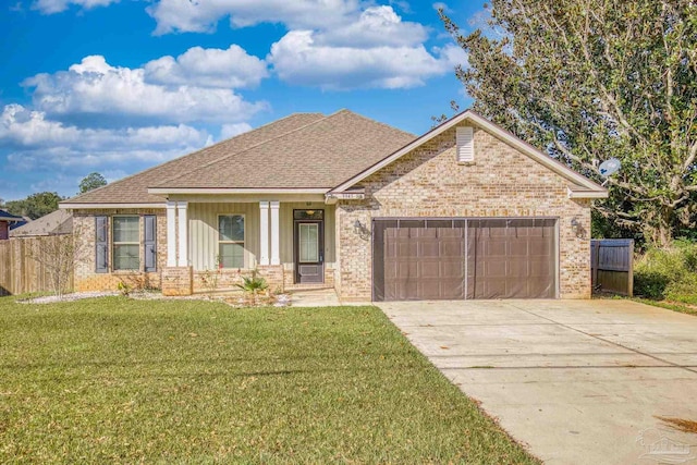 view of front of home with a front lawn and a garage