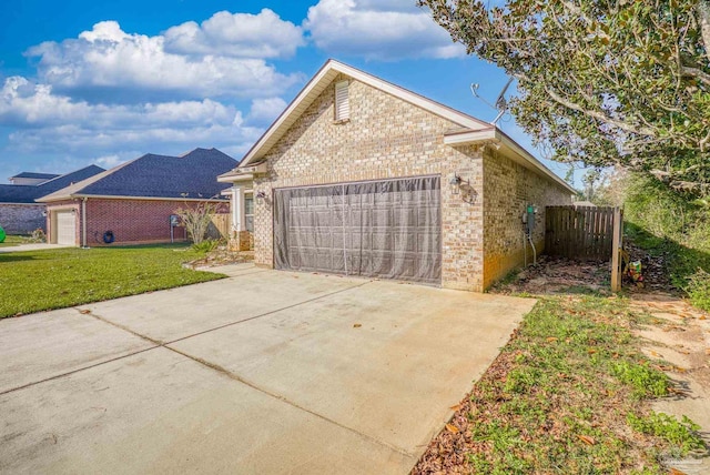 view of side of property with a yard and a garage