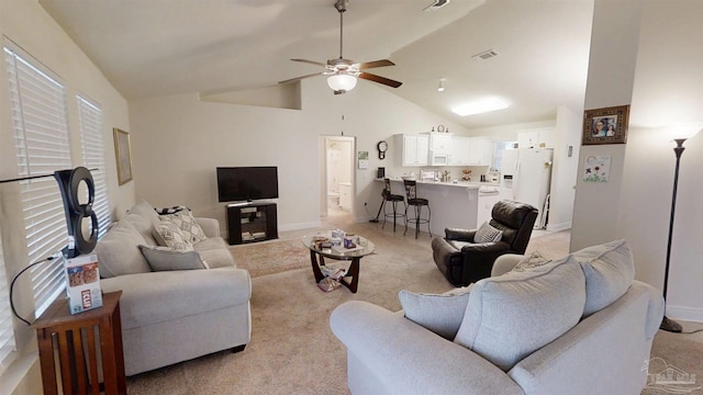 living room with light carpet, visible vents, baseboards, ceiling fan, and high vaulted ceiling