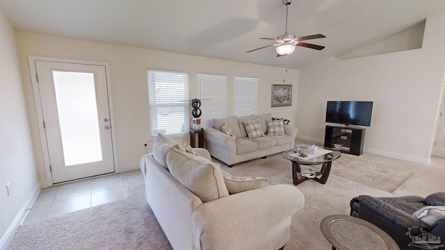 living area with light tile patterned floors, lofted ceiling, light carpet, a ceiling fan, and baseboards