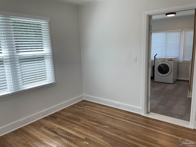 803 Pickens Ave, Pensacola, FL 32503 - spare room with washer / clothes dryer, wood finished floors, baseboards, and crown molding