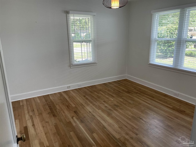 803 Pickens Ave, Pensacola, FL 32503 - spare room featuring baseboards and wood finished floors