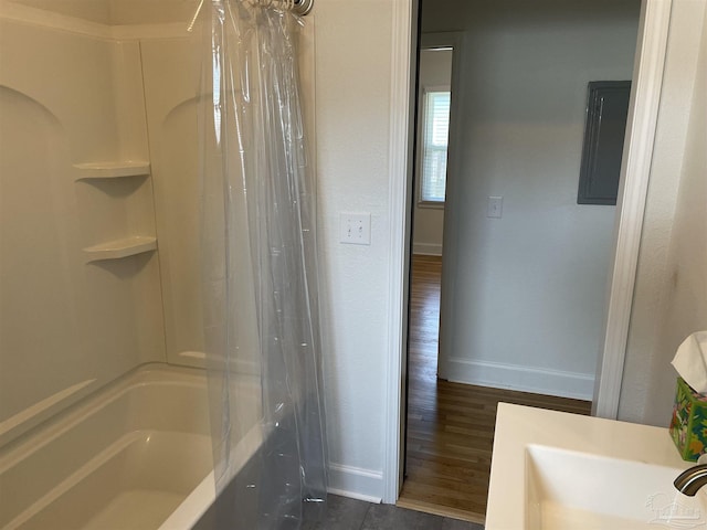 803 Pickens Ave, Pensacola, FL 32503 - full bathroom with baseboards, electric panel, and shower / bath combo with shower curtain