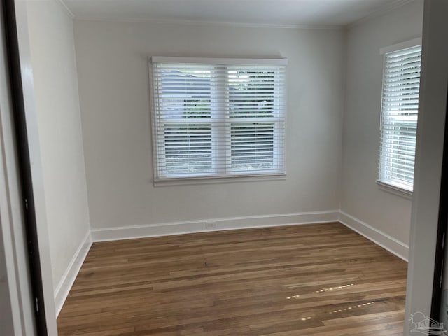 803 Pickens Ave, Pensacola, FL 32503 - spare room featuring wood finished floors, crown molding, and baseboards