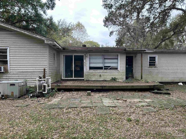 rear view of house featuring a deck