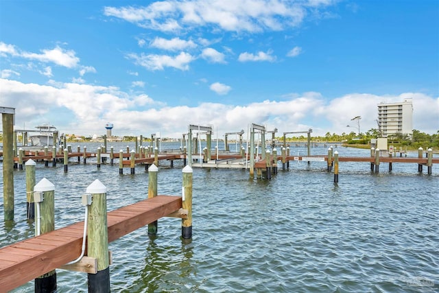 dock area with a water view and boat lift