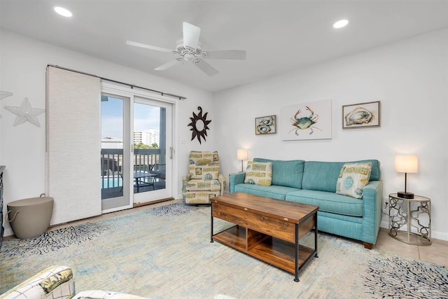 living area with ceiling fan, light tile patterned flooring, and recessed lighting