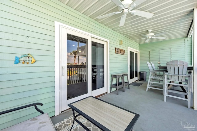 exterior space featuring ceiling fan