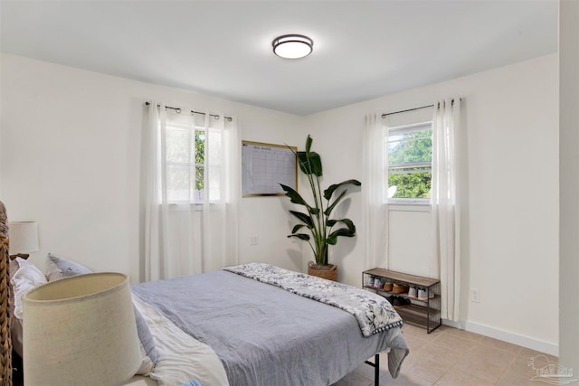 bedroom with light tile patterned flooring