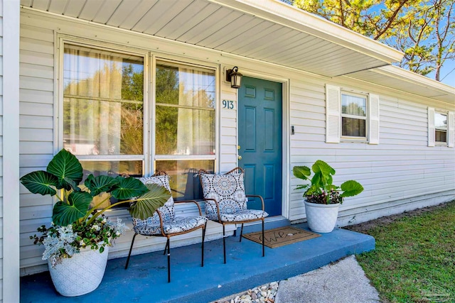 doorway to property with covered porch