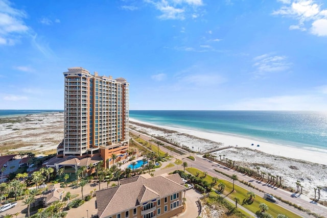 birds eye view of property with a beach view and a water view