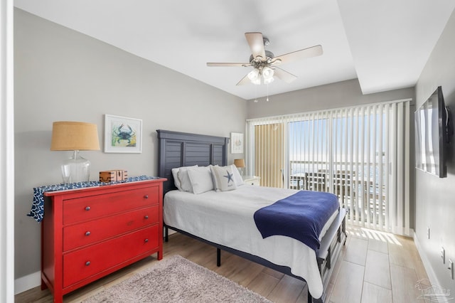 bedroom with light hardwood / wood-style floors and ceiling fan