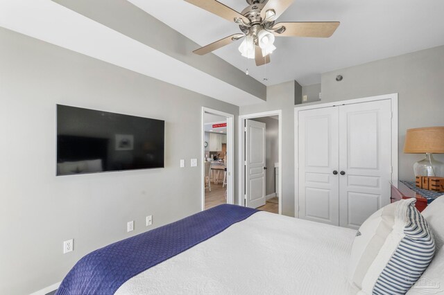 bedroom featuring ceiling fan and a closet