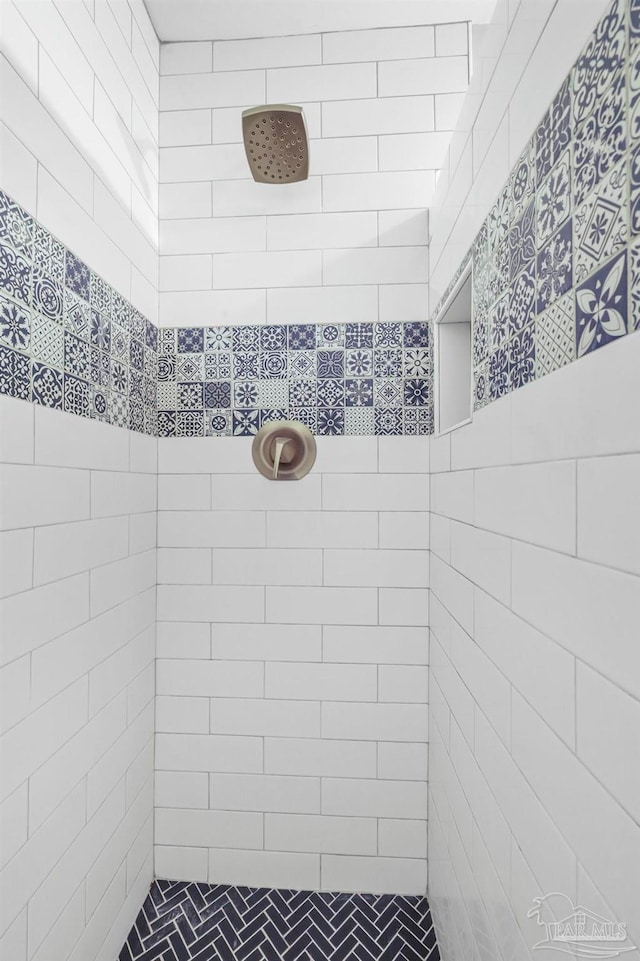 bathroom with tiled shower