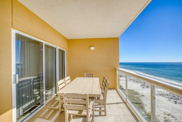 balcony with a beach view and a water view