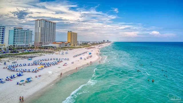 drone / aerial view featuring a view of the beach and a water view