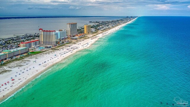 aerial view featuring a view of the beach and a water view