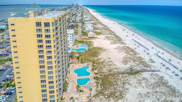 birds eye view of property featuring a view of the beach and a water view