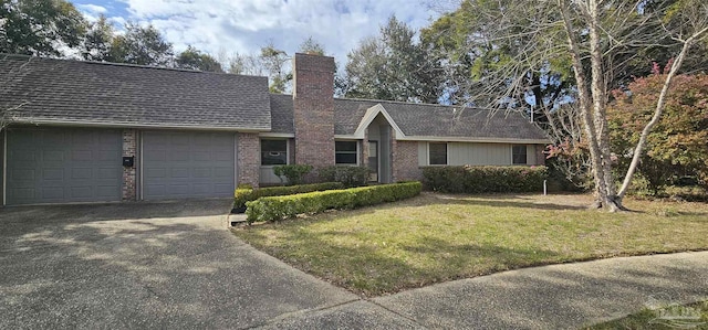 ranch-style home featuring aphalt driveway, a garage, brick siding, a front lawn, and a chimney