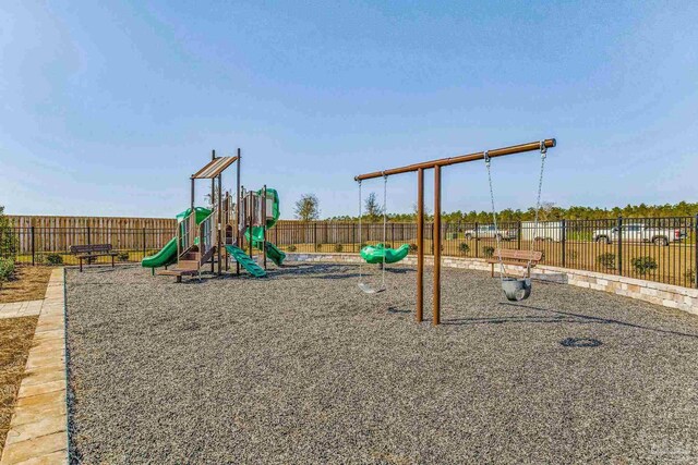community jungle gym featuring fence