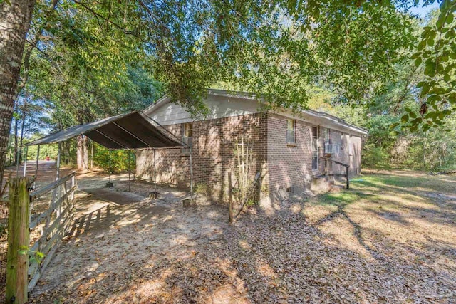 view of home's exterior featuring a carport