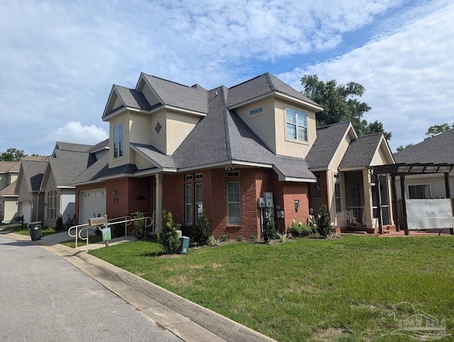 view of front of home featuring a garage and a front yard