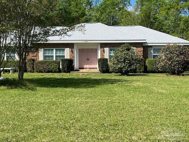 single story home with a front yard