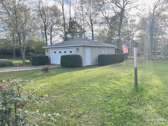 exterior space with a lawn and a garage