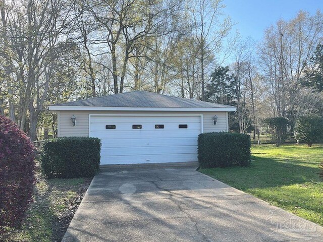 garage with a lawn