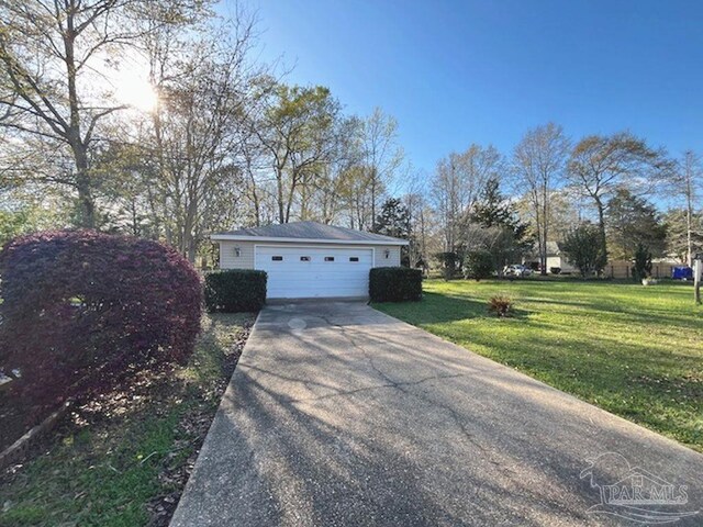 garage featuring a yard