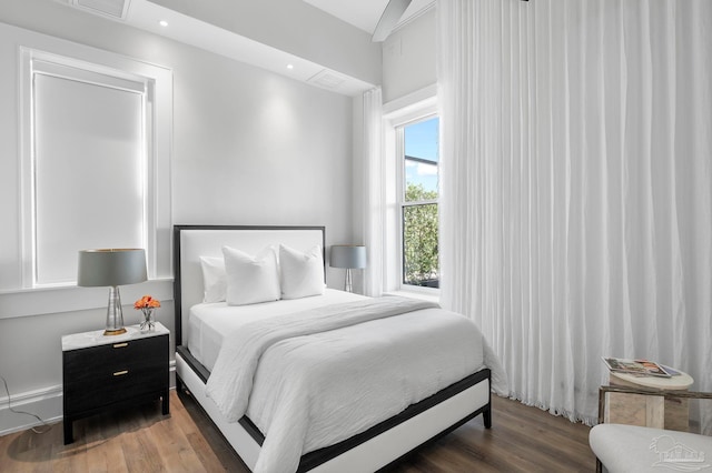 bedroom featuring recessed lighting and wood finished floors