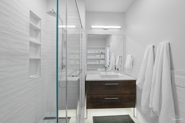 bathroom with vanity, tile patterned flooring, and an enclosed shower