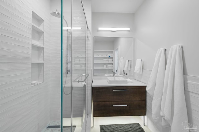 bathroom featuring vanity and a shower stall
