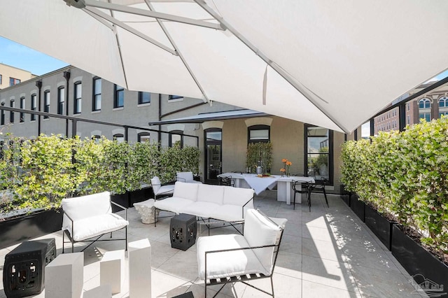 view of patio / terrace with outdoor dining area and an outdoor hangout area