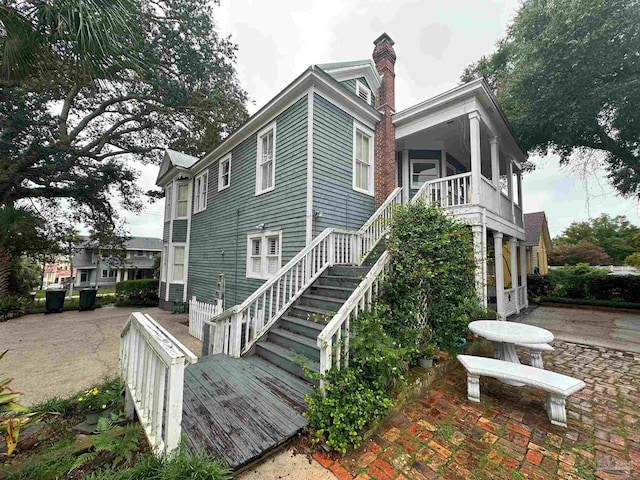 view of property exterior featuring a patio area