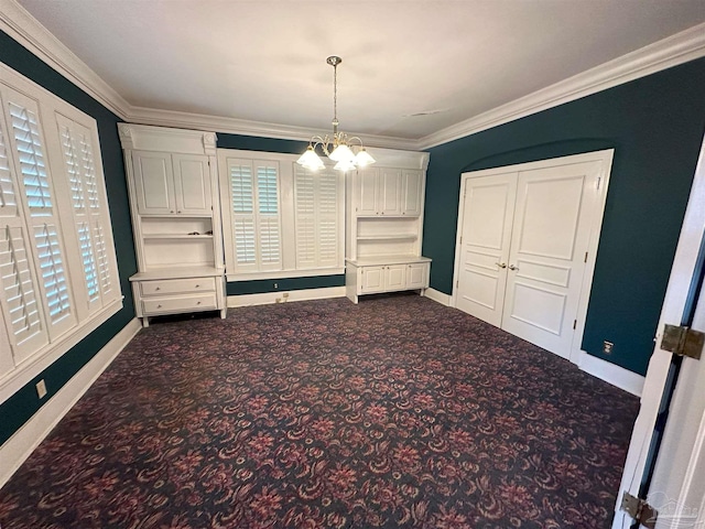 interior space featuring ornamental molding, a chandelier, and carpet flooring