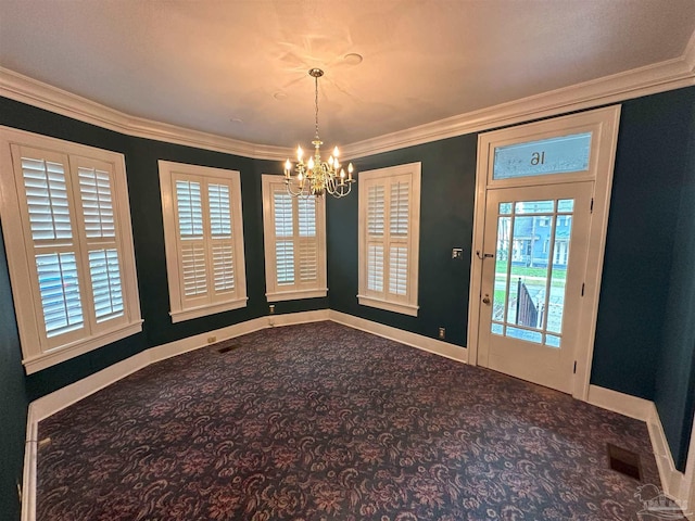 unfurnished dining area featuring crown molding, carpet floors, and a chandelier