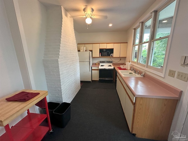 kitchen featuring sink, white appliances, and ceiling fan