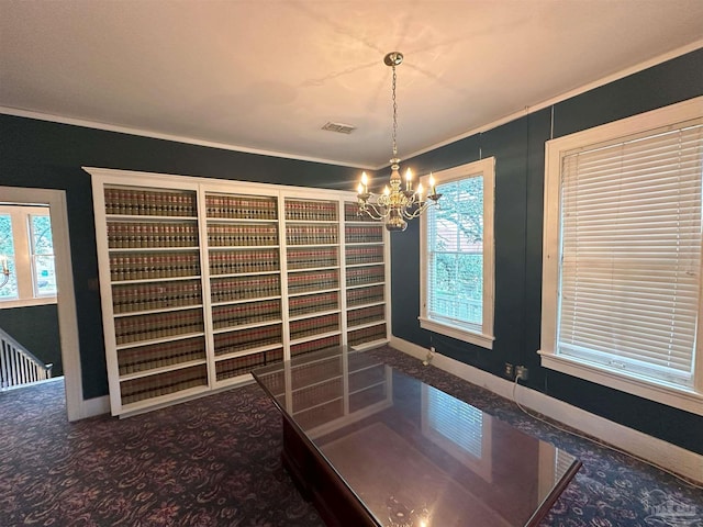 unfurnished dining area featuring crown molding, carpet, a wealth of natural light, and a chandelier